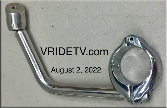 Harley-Davidson VROD windshield riser, handlebar clamp, Allen bolt & piece of windshield mount.