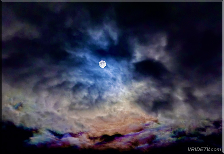 cloud formation around a full moon