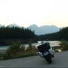 Sunset at the Athabasca River in Jasper National Park, Alberta, Canada. Harley-Davidson V-Rod at this point of interest along side the Icefields Parkway, Highway 93.