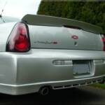 Body coloured lower ground effects, Racing inspired rear spoiler, Exhaust tip extensions