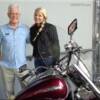 John Tilley with diane beside his bike behind the store.