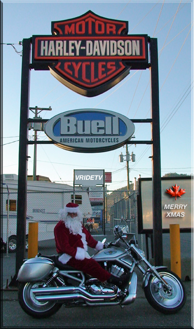 Santa rides a Harley Davidson motorcycle