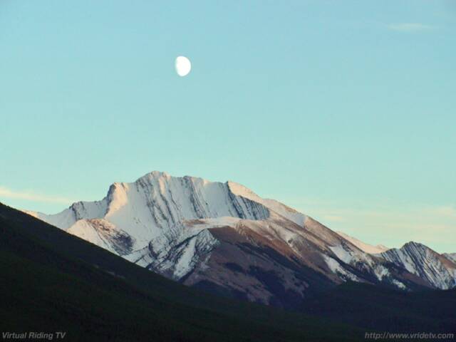 moon over Kananaskis mountain range, Alberta Canada. vridetv.com Virtual Riding TV
